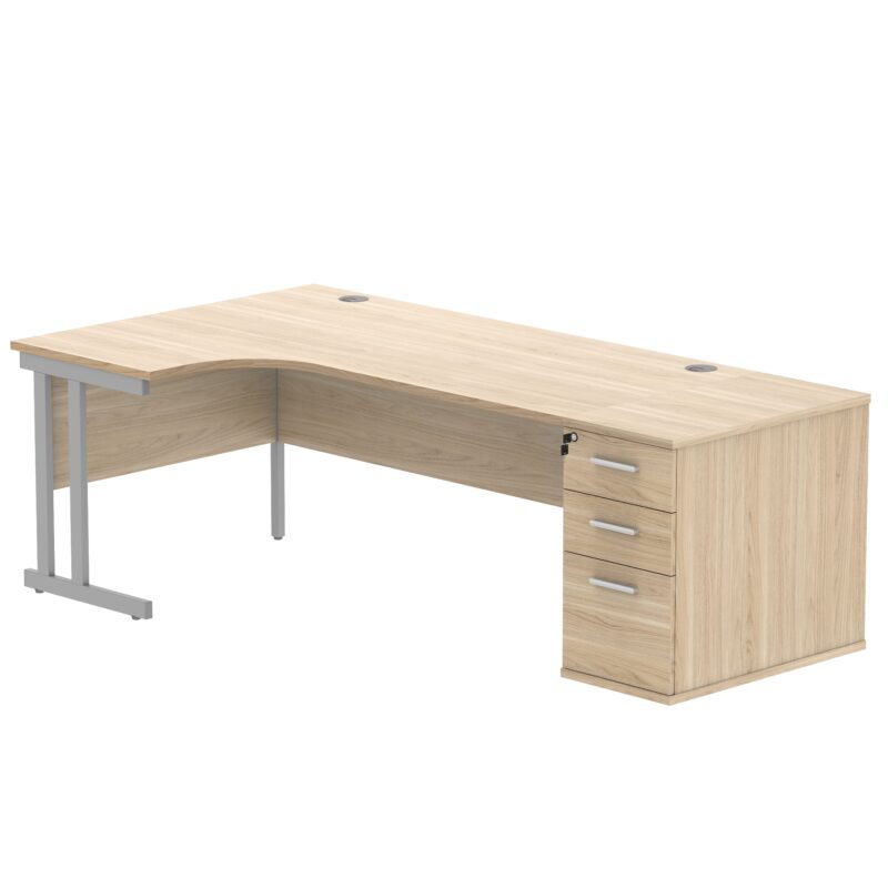 Double Upright Left Hand Radial Desk + Desk High Pedestal | 800mm Deep Pedestal | 1800X1200 | Canadian Oak/Silver