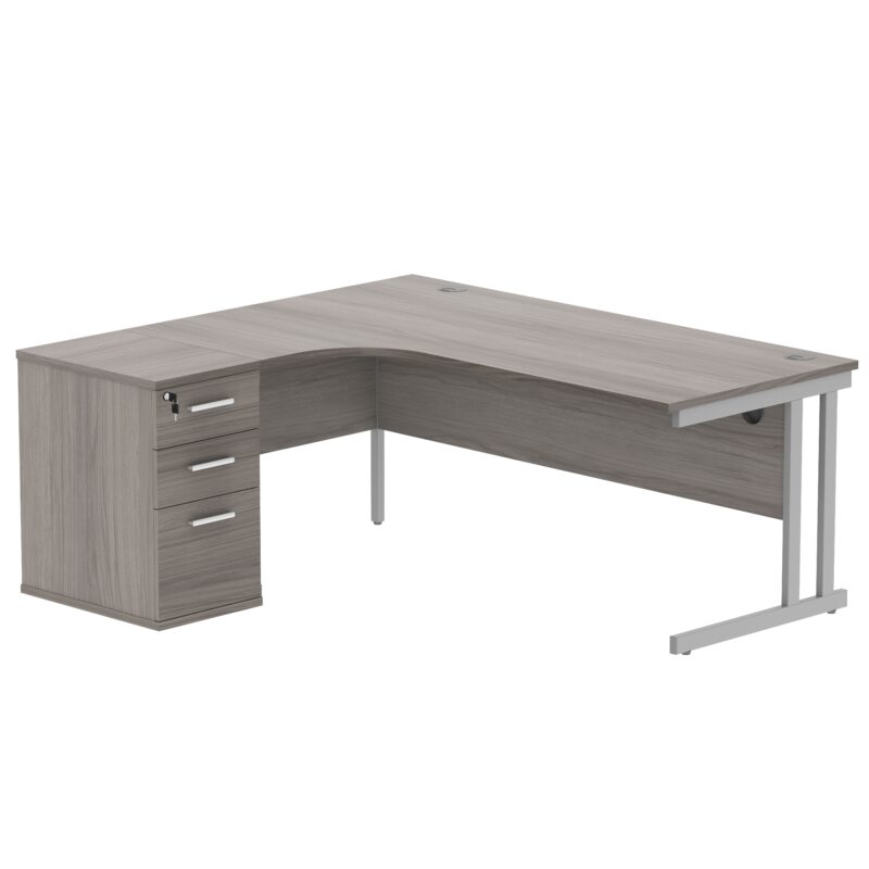 Double Upright Left Hand Radial Desk + Desk High Pedestal | 600mm Deep Pedestal | 1800X1200 | Alaskan Grey Oak/Silver